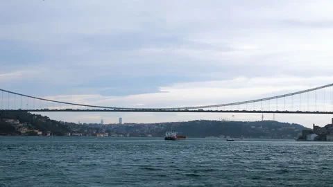 Long scenic panorama of cable-stayed bridge with cars moving across Bosphorus Stock Footage 258946341