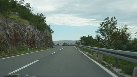 Long serpentine road winding through Croatia mountains Stock Footage 299895760