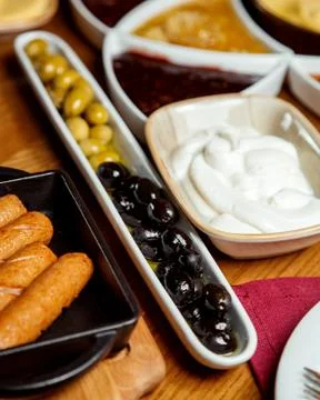 Long shape serving with green and black olives Stock Photos