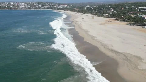 Long Shoreline With Waves Pulling Back Into the Sea Puerto Escondido Mexico Stock Footage 321900003