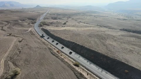 Long Shot  4K Drone Landscape View 4X4 Vehicle On Road and Plains Cappadocia Stock Footage 169454729