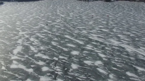 Long Shot and pull up of ice fishing 動画素材 85633654