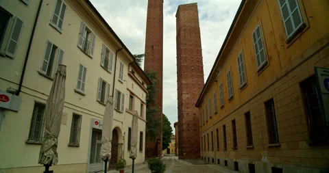 Long Shot and Tilt Down of Two Medieval Watchtowers in Pavia, Italy Stock Footage 203574375