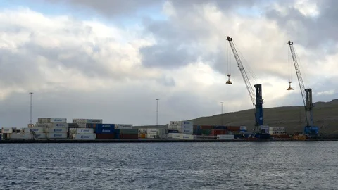 Long shot of cargo containers and cranes in a port near sea Stock Footage 92641180