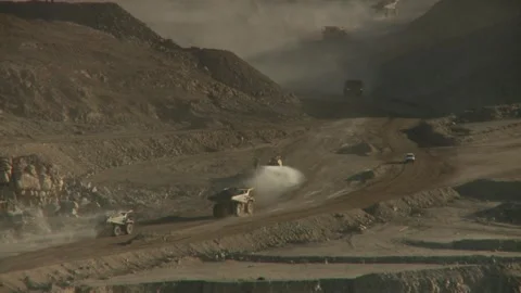 Long shot of construction vehicles on an opencast mine Stock Footage 312400389