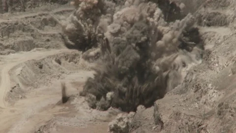 Long shot of an explosion on an opencast mine Stock Footage 312400489