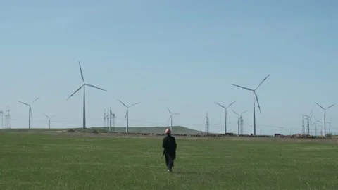 Long shot of female engineer walking in the windmill Stock Footage 238009102