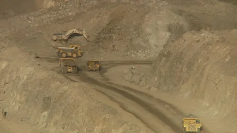 Long shot of a fleet of construction machinery on an opencast mine Stock Footage 312400391