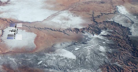 Long shot: flying parallel to the ISS, over the Grand Canyon Stock Footage 120148274