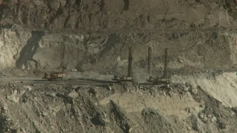 Long shot of four drill rigs in an opencast mine Stock Footage 312400335