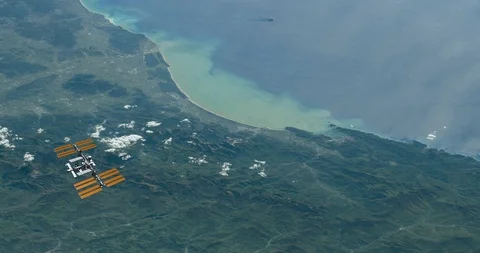 Long shot: ISS flying into the distance, over the Italian coastline Stock-Footage 120149007