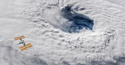 Long shot: ISS flying into the distance, over the eye of Hurricane Florence Stock-Footage 120149136