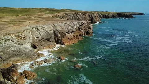 Long shot over the wild coast of a peninsula in brittany France Stock Footage