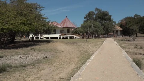 Long shot of path to entrance huts into Komodo sanctuary on Rinca Island Stock Footage 86771738