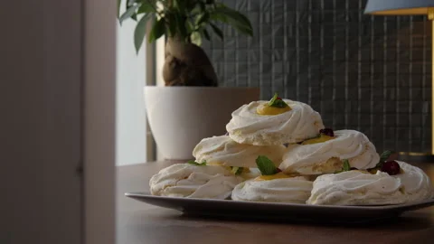 Long shot of a pyramid built of large swirled meringues 스톡 동영상 168182411