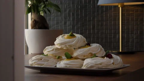 Long shot of a pyramid built of large swirled meringues 스톡 동영상 168182510