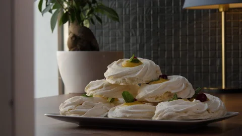 Long shot of a pyramid built of large swirled meringues 스톡 동영상 168182613