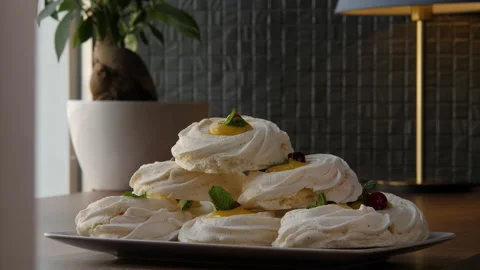 Long shot of a pyramid built of large swirled meringues 库存影片 168182744