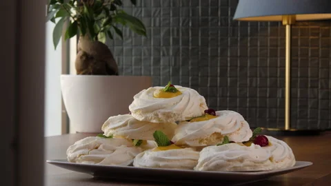 Long shot of a pyramid built of large swirled meringues 스톡 동영상 168183526