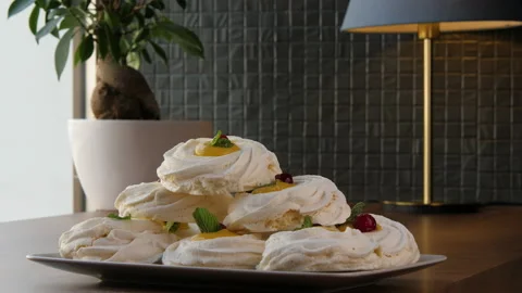 Long shot of a pyramid built of large swirled meringues 스톡 동영상 168183627