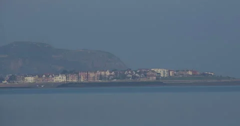 Long shot of Rhos on Sea from at Traeth Hen Golwyn, Old Colwyn Beach Stock Footage 346109867
