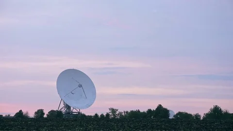 Long shot of the satellite array with trees Stock Footage 82118363