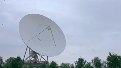 Long shot of the satellite array with trees Stock Footage 82286220