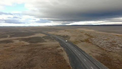 Long Shot of SUV Driving Through the Plains of North Iceland Stock Footage 130139804