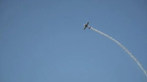 Long shot of taking off small-seat plane performing a flip in cloudy sky Stock Footage 220494147