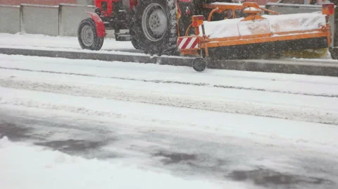 Long shot of tractor cleaning up tram station Video stock 59643105