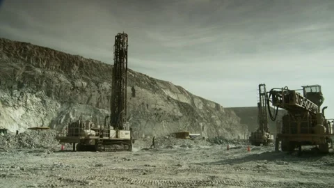 Long shot of two drill rigs on a construction site on an opencast mine Stock Footage 312400418