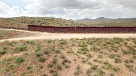 Long  Shot US border wall changes to Normandy fence Stock-Footage 63629108