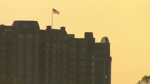 A Long Shot of a US Flag over Washington, DC Stock Footage 38759326
