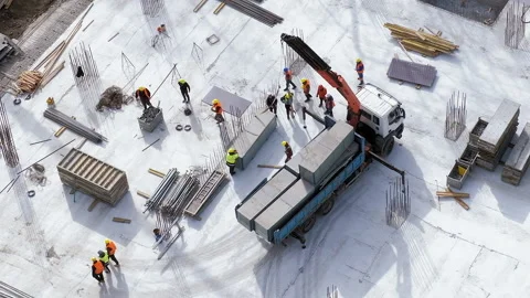 Long shot: Workers take away a colleague injured on truck at a construction site Stock Footage 236473679