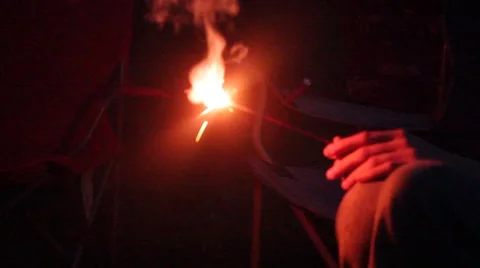 Long slender hand holds sparkler Video stock 40211046