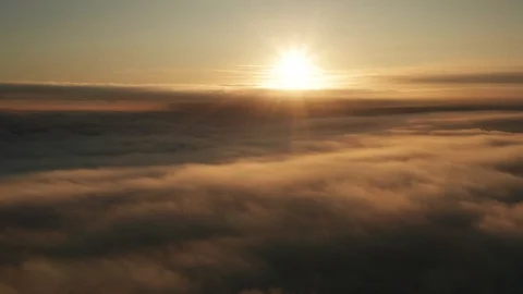 Long slow dramatic cloudscape aerial shot at sunrise Stock Footage 118594307