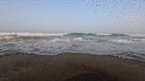 Long slow motion shot of sea waves at sunset with underwater bubbles drople.. Stock Footage 342586475
