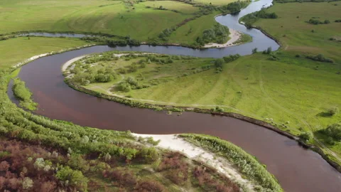 The long, snake-shaped river goes into the distance over the horizon. Stock Footage 170568126