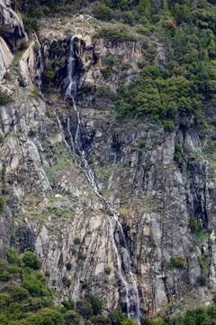 Long spidery cliff waterfall Stock Photos