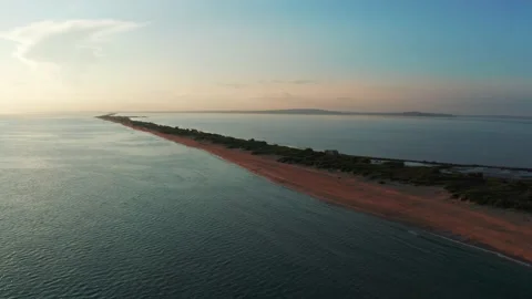 Long spit with beautiful sandy beach between sea and liman , aerial view from Stock Footage 161128465