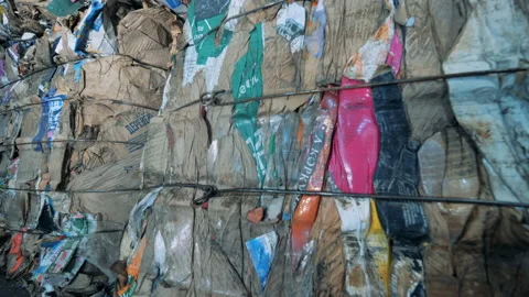 Long stacks of garbage, close up. Pressed plastic trash is at a recycling Video stock 94581813