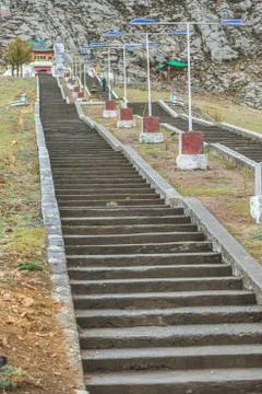 Long steps leading to Buddha statue Stock Photos