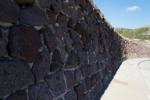 Long stone wall Stock Photos
