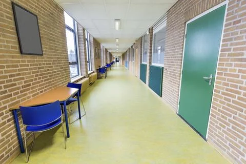 Long straight and empty corridor in college school building Fotos de archivo