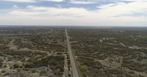 Long straight road with surrounding trees and paths, Texas, USA drone aerial 4K Stock Footage 111316831