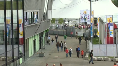 Long street shot - crowd walking outside the stadium Stock Footage 47862355
