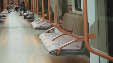 Long subway car. Empty gray seats. Video stock 166960325