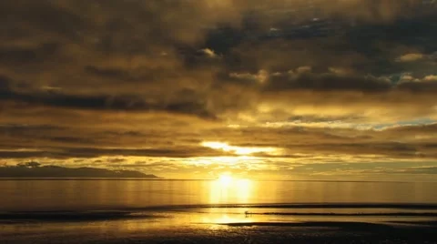 Long Sunset Clouds over Bay with Ship and People Low Tide Stock Footage 12531738