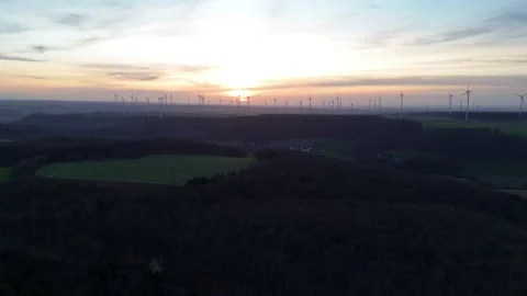 Long sunset composition across turbines and evening sky Stock Footage 331214083