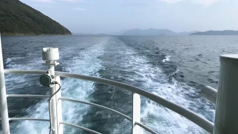 Long swirl wave from back of passenger ferry ship sailing in ocean Stock Footage 153464646